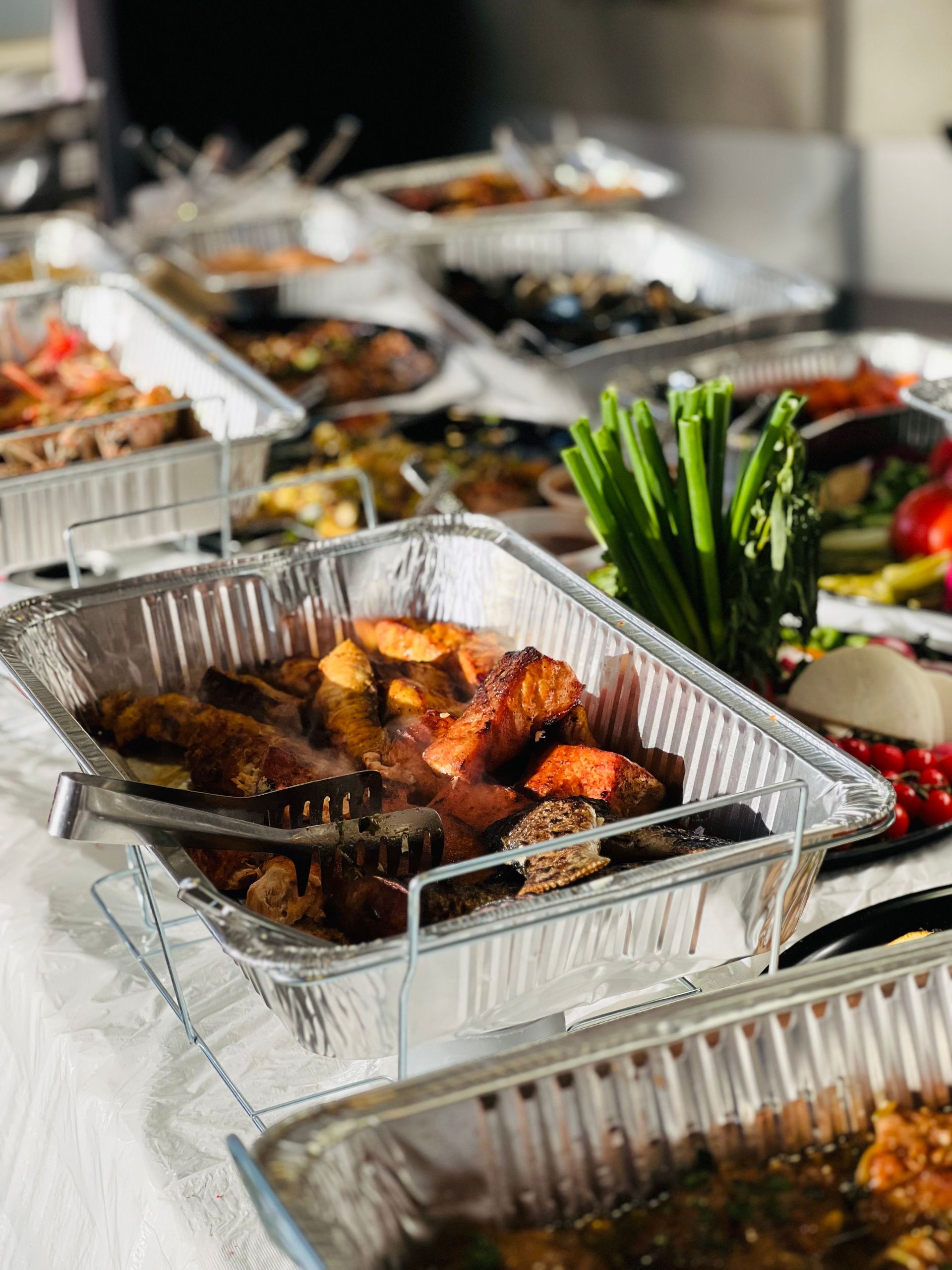 A mouth-watering buffet showcasing various cooked meats, perfect for celebrations.